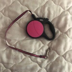 Pink and black retractable leash.